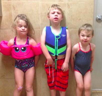 When mom finds only one little boy bathing suit in the bag, she'll improvise.